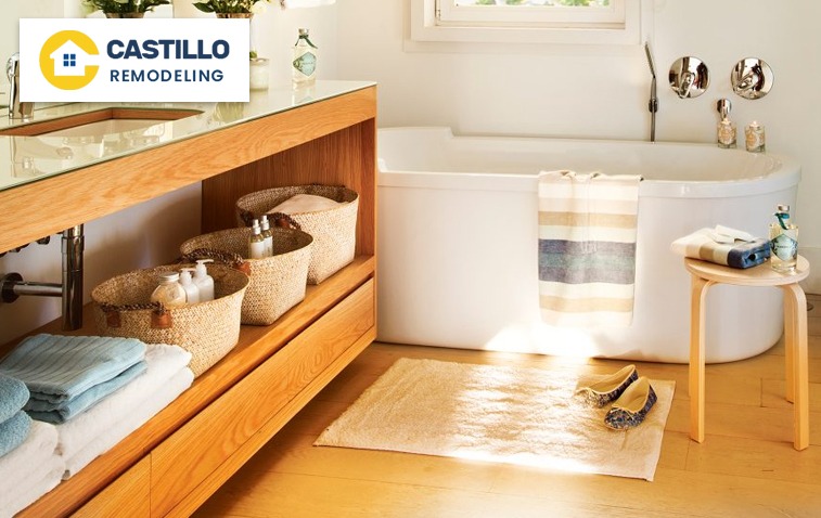 Compact bathroom featuring under-vanity storage and a tub.